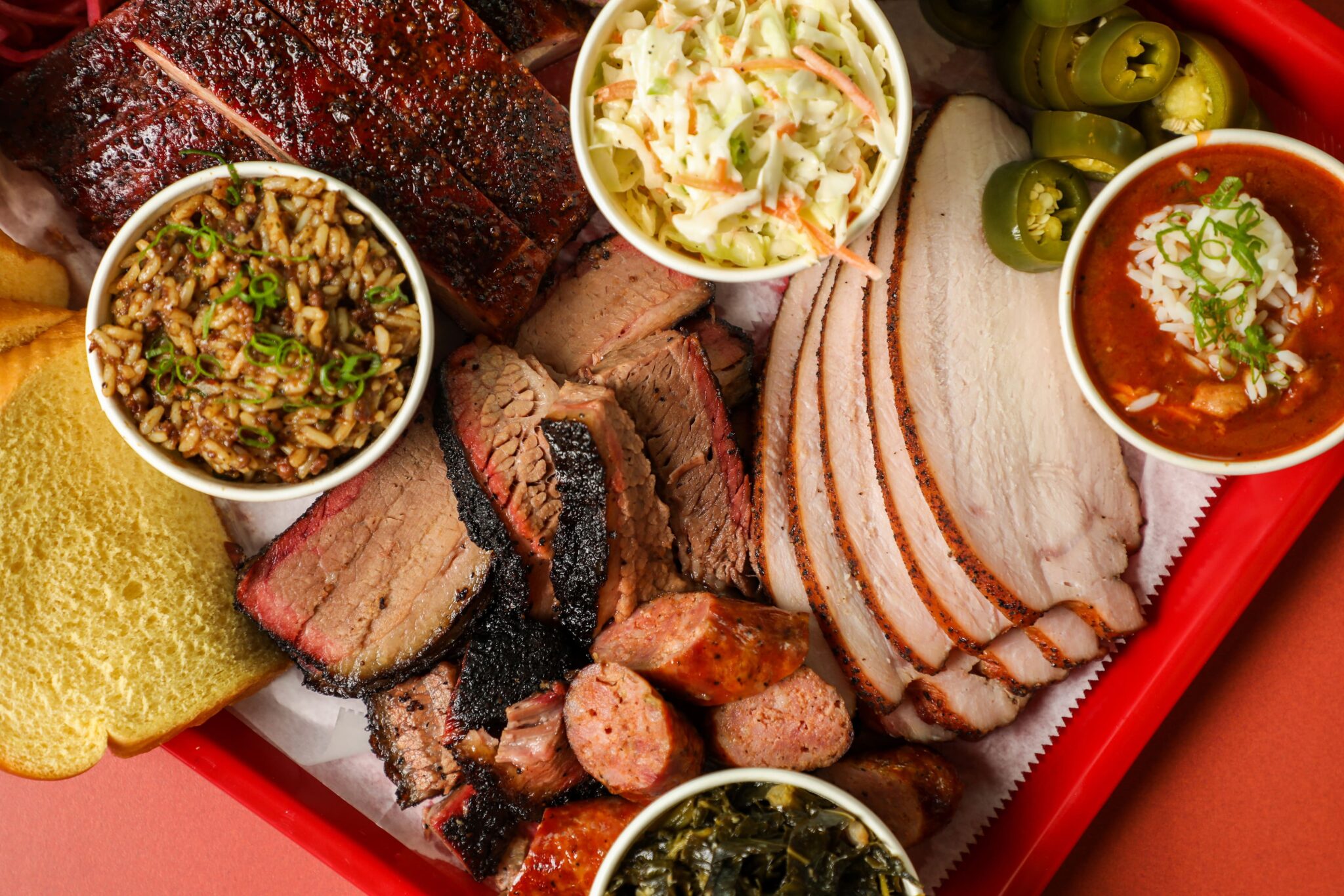 Platter of meats and sides from Devil Moon BBQ located in NOLA